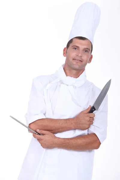 Un macellaio con un coltello e un temperamatite — Foto Stock