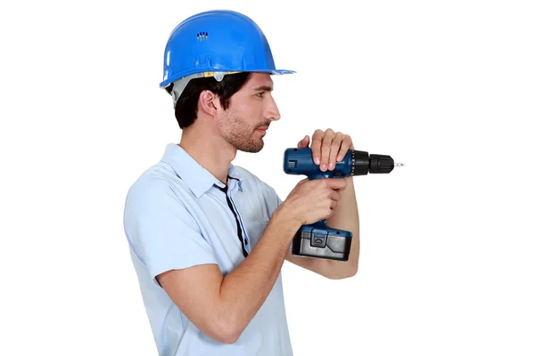 Handyman i profil med drill — Stockfoto