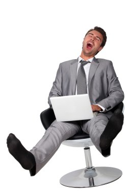 Business with computer yawning clipart