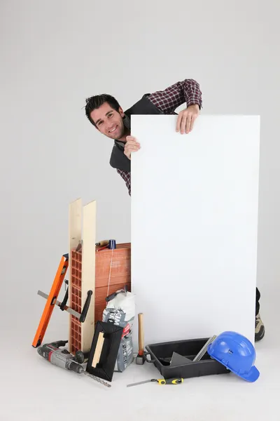 Constructor con una placa en blanco — Foto de Stock
