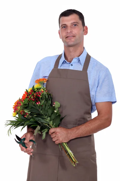 A florist with a flowers bouquet — Stock Photo, Image