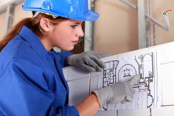 Woman with electrical diagram — Stock Photo, Image
