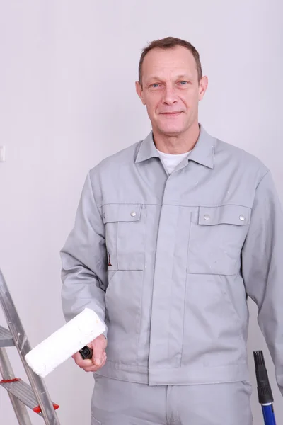 45 years old house painter taking a cylinder — Stock Photo, Image