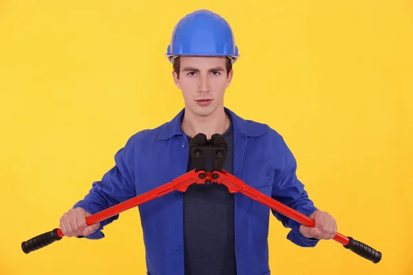Young worker with bolt cutters — Stock Photo, Image