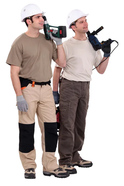 Workmen holding drills — Stock Photo, Image