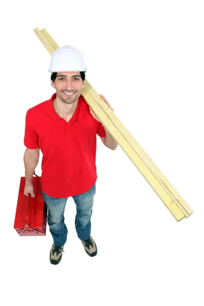 Construtor com madeira e uma caixa de ferramentas — Fotografia de Stock
