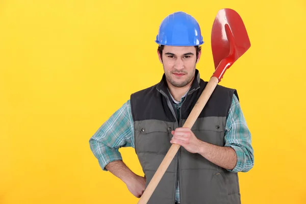 Builder stood with spade — Stock Photo, Image