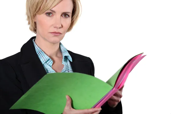 Blond woman holding folders — Stock Photo, Image