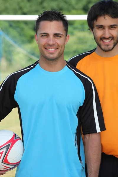 Jogadores de futebol sorrindo — Fotografia de Stock