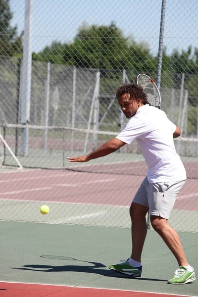 Tennis player in action — Stock Photo, Image