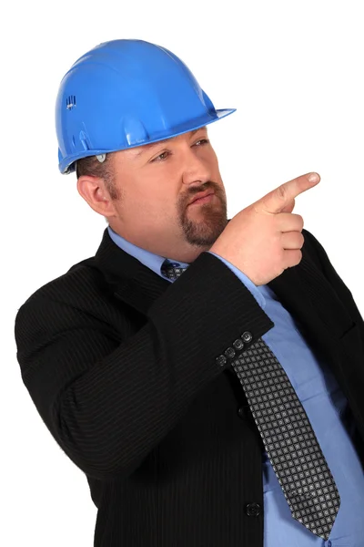 Διαχειριστής κατασκευή, επισημαίνοντας το δάχτυλό του — Φωτογραφία Αρχείου
