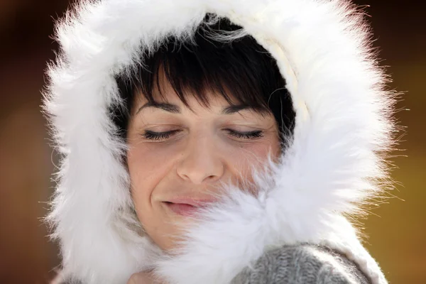 Woman in a furry hood — Stock Photo, Image
