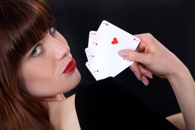 Alluring woman playing cards clipart