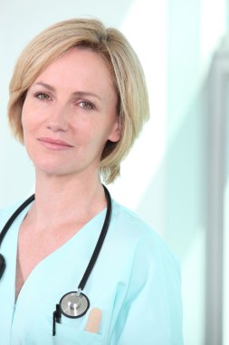 Female nurse with stethoscope around neck clipart