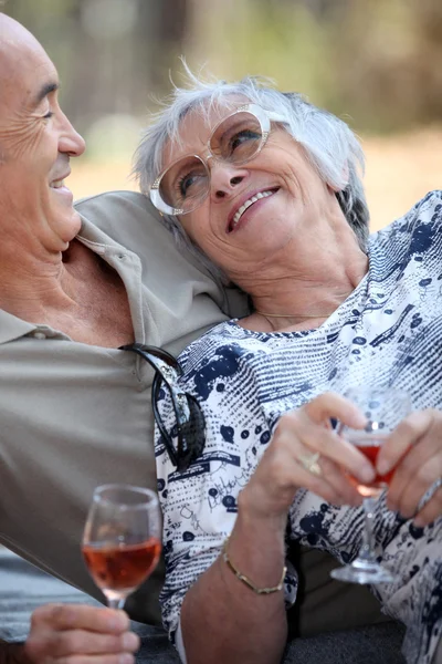 Elderly drinking wine. — Stock Photo, Image
