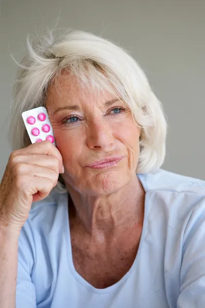 Woman fed up with taking her medication — Stock Photo, Image