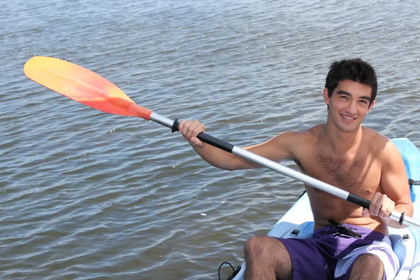 Young man on a kayak — Stock Photo, Image