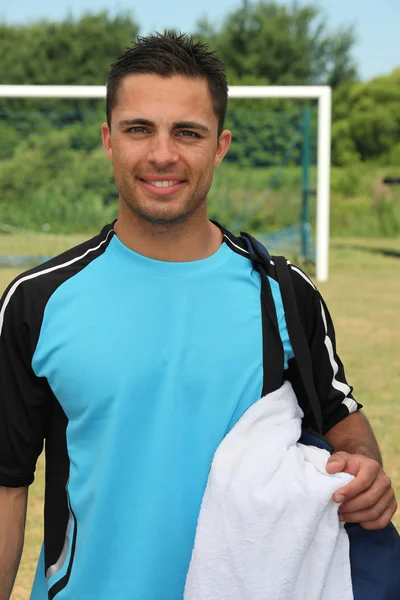 Jogador de futebol com saco — Fotografia de Stock