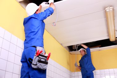 Two electrician inspection ceiling panels clipart