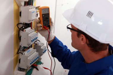Electrical inspector reading power output clipart