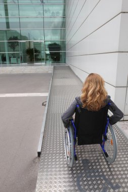 Woman in a wheelchair clipart