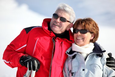 Old couple skiing clipart