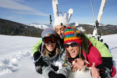 Group of friends on a skiing holiday together clipart