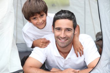 Father and son in tent clipart