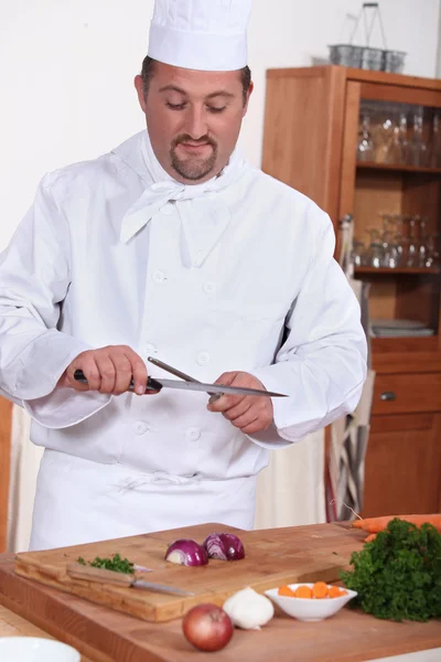 Portrait of a cook in kitchen — Stock Photo, Image