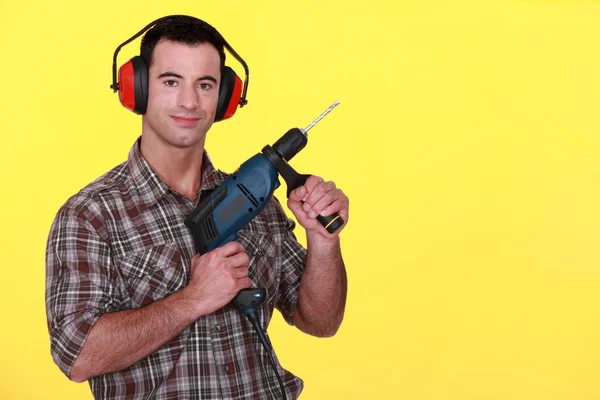 Man with a power drill — Stock Photo, Image