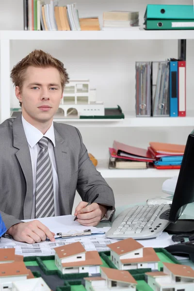 Young architect sitting at his desk — Stock Photo, Image