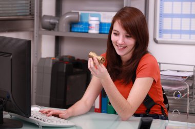 Girl ordering pipes on the computer clipart