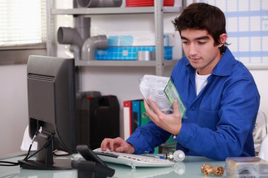 Worker looking at a building part clipart