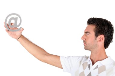 Man holding the at symbol clipart