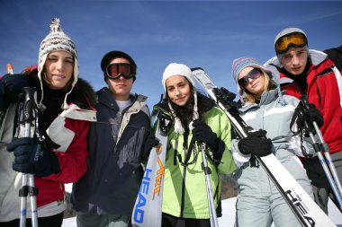 Group of teenagers on a ski trip clipart