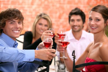 2 couples enjoying meal together clipart