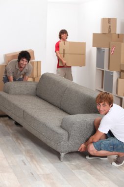 Young men moving home clipart