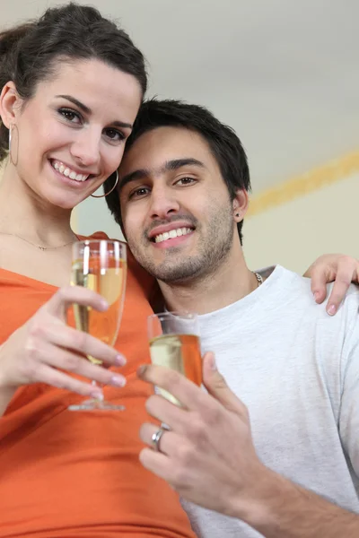 Couple drinking a celebratory drink — Stock Photo, Image