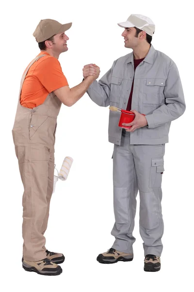 Dois pintores artesãos apertando as mãos — Fotografia de Stock