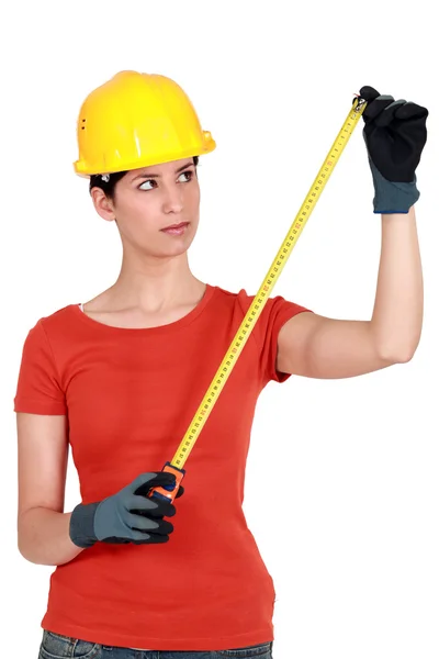 Craftswoman holding a meter — Stock Photo, Image