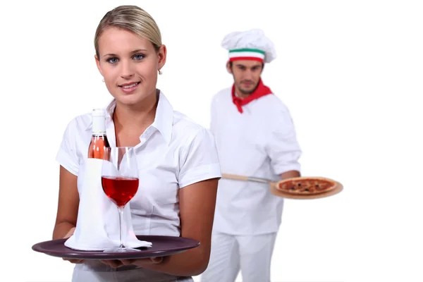Young working in a restaurant — Stock Photo, Image