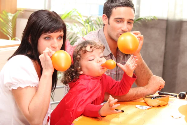 Parents and little boy preparing Halloween party — Stock Photo, Image