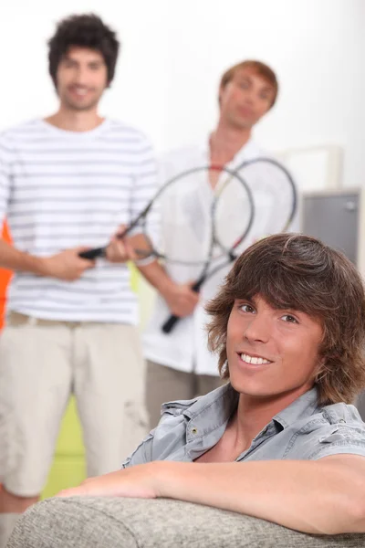 Portrait of a young man with friends — Stock Photo, Image