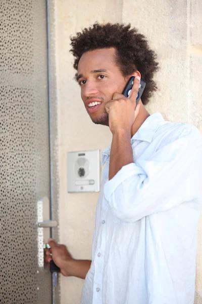 Portrait of a young man at door — Stock Photo, Image