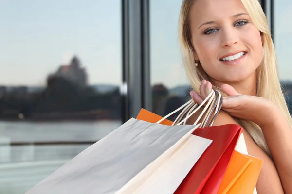 Young blond carrying shopping bags — Stock Photo, Image