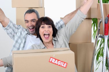 Couple celebrating moving in clipart