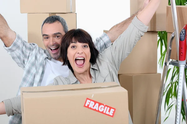 Couple celebrating moving in — Stock Photo, Image