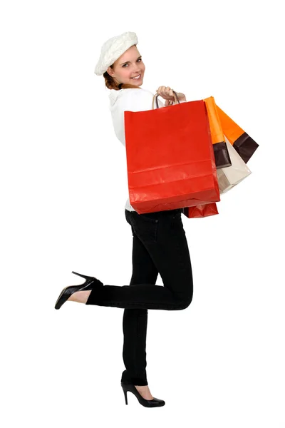 Žena držící četné nákupní tašky — Stock fotografie