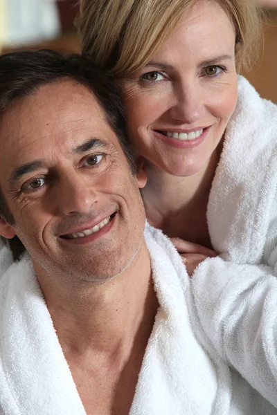 Couple in robes — Stock Photo, Image