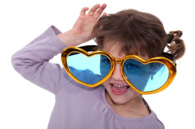 Young girl wearing oversized heart-shaped glasses clipart